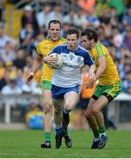 19 July 2015; Karl O'Connell, Monaghan, in action against Michael Murphy, left, and Odhrán Mac Niallas, Donegal. Ulster GAA Football Senior Championship Final, Donegal v Monaghan, St Tiernach's Park, Clones, Co. Monaghan. Picture credit: Dáire Brennan / SPORTSFILE