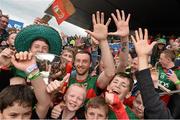 19 July 2015; Mayo captain Keith Higgins celebrates with supporters after Mayo won their fifth Nestor Cup in a row. Connacht GAA Football Senior Championship Final, Mayo v Sligo, Dr. Hyde Park, Roscommon. Picture credit: David Maher / SPORTSFILE