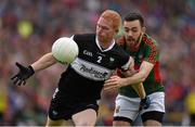 19 July 2015; Ross Donovan, Sligo, in action against Kevin McLoughlin, Mayo. Connacht GAA Football Senior Championship Final, Mayo v Sligo, Dr. Hyde Park, Roscommon. Photo by Sportsfile