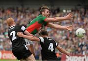 19 July 2015; Aidan O'Shea, Mayo, in action against Ross Donavan, left, and Daniel Maye, Sligo. Connacht GAA Football Senior Championship Final, Mayo v Sligo, Dr. Hyde Park, Roscommon. Picture credit: David Maher / SPORTSFILE