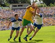19 July 2015; Christy Toye, Donegal, in action against Ryan Wylie and Conor McManus, Monaghan. Ulster GAA Football Senior Championship Final, Donegal v Monaghan, St Tiernach's Park, Clones, Co. Monaghan. Picture credit: Oliver McVeigh / SPORTSFILE