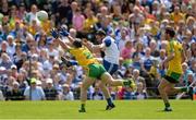 19 July 2015; Owen Duffy, Monaghan, scores a point despite the attempts of Paddy McGrath, Donegal. Ulster GAA Football Senior Championship Final, Donegal v Monaghan, St Tiernach's Park, Clones, Co. Monaghan. Picture credit: Oliver McVeigh / SPORTSFILE