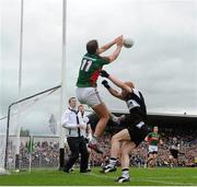 19 July 2015; Aidan O'Shea, Mayo, in action against Ross Donavan, Sligo. Connacht GAA Football Senior Championship Final, Mayo v Sligo, Dr. Hyde Park, Roscommon. Picture credit: David Maher / SPORTSFILE