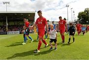 19 July 2015; UCD and Liverpool XI players make their way onto the pitch for the start of the game. UCD v Liverpool XI - Friendly, Belfield Bowl, UCD, Dublin. Picture credit: Matt Browne / SPORTSFILE
