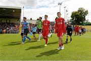 19 July 2015; UCD captain Chris Mulhall and Liverpool XI captain Cameron Brannagan lead their players onto the pitch for the start of the game. UCD v Liverpool XI - Friendly, Belfield Bowl, UCD, Dublin. Picture credit: Matt Browne / SPORTSFILE