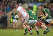 11 July 2015; Connor McAliskey, Tyrone, in action against Donal Keogan, centre, and Donncha Tobin, Meath . GAA Football All-Ireland Senior Championship, Round 2B, Tyrone v Meath, Healy Park, Omagh, Co. Tyrone. Picture credit: Brendan Moran / SPORTSFILE