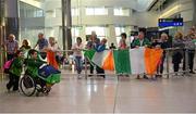 20 July 2015; Family and friends welcome back the Irish Paralympic Swim team on their return from the 2015 IPC Swimming World Championships in Scotland. Pictured are athletes James Scully and Nicole Turner. Terminal 2, Dublin Airport, Dublin. Picture credit: Piaras Ó Mídheach / SPORTSFILE