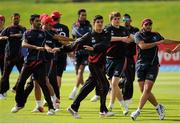 21 July 2015; Hong Kong players warm up ahead of their match against Afghanistan. ICC World Twenty20 Qualifier 2015, Play-Off 1, Hong Kong v Afghanistan, Malahide, Dublin. Picture credit: Seb Daly / ICC / SPORTSFILE