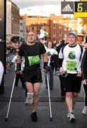 27 October 2008; Simon Baker, 3775, from Limerick, completes the Lifestyle Sports - adidas Dublin Marathon, breaking a world record by completing it on crutches in a final time of 6 hours 47 minutes, raising funds for the Bubble Gum Club. Merrion Square, Dublin. Picture credit: Brendan Moran / SPORTSFILE