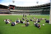 28 October 2008; Members of the squad warm up under the watchful eyes of selector Eoin Liston and manager Sean Boylen during an Ireland International Rules training session. 2008 International Rules tour, Melbourne Cricket Ground, Melbourne, Auatralia. Picture credit: Ray McManus / SPORTSFILE