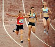 16 September 2008; Morocco's Sanaa Benhama, left, celebrates winning the Women's 100m - T13 final in a world record time of 12.28 ahead of 2nd place Ilse Hayse of South Africa, centre, and 4th place Nantenin Keita of France. Beijing Paralympic Games 2008, Women's 100m - T13 Final, National Stadium, Olympic Green, Beijing, China. Picture credit: Brian Lawless / SPORTSFILE