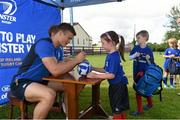 22 July 2015; Leinster rugby players Cathal Marsh and Josh Van Der Flier visited the Bank of Ireland Summer Camp in Tullow RFC to meet with young players. Pictured are Josh Van Der Flier signing autographs for camp participants. Tullow RFC - Blackgate, Tullow, Co. Carlow. Picture credit: Matt Browne / SPORTSFILE