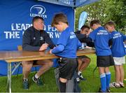 22 July 2015; Leinster rugby players Colm O'Shea and Gavin Thornbury visited the Bank of Ireland Summer Camp at Seapoint RFC to meet with young players. Pictured Gavin Thornbury, left, and Colm O'Shea, sign jerseys for camp participants. Seapoint RFC, Killiney, Co. Dublin. Picture credit: Sam Barnes / SPORTSFILE