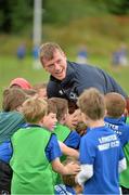 22 July 2015; Leinster rugby players Colm O'Shea and Gavin Thornbury visited the Bank of Ireland Summer Camp at Seapoint RFC to meet with young players. Pictured Gavin Thornbury tries to keep the ball from a group of camp participants. Seapoint RFC, Killiney, Co. Dublin. Picture credit: Sam Barnes / SPORTSFILE