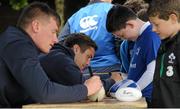 22 July 2015; Leinster rugby players Colm O'Shea and Gavin Thornbury visited the Bank of Ireland Summer Camp at Seapoint RFC to meet with young players. Pictured Gavin Thornbury and Colm O'Shea sign autographs to camp participants. Seapoint RFC, Killiney, Co. Dublin. Picture credit: Sam Barnes / SPORTSFILE