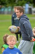 22 July 2015; Leinster rugby players Colm O'Shea and Gavin Thornbury visited the Bank of Ireland Summer Camp at Seapoint RFC to meet with young players. Pictured Colm O'Shea tries to keep the ball from a group of camp participants. Seapoint RFC, Killiney, Co. Dublin. Picture credit: Sam Barnes / SPORTSFILE