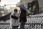 22 July 2015; Supporters shelter from the rain before the game between Dundalk and FC BATE Borisov. UEFA Champions League, Second Qualifying Round, Second Leg, Dundalk v FC BATE Borisov, Oriel Park, Dundalk, Co. Louth. Picture credit: David Maher / SPORTSFILE