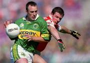 2 September 2000; John Crowley of Kerry is tackled by Justin McNulty of Armagh during the Bank of Ireland All-Ireland Senior Football Championship Semi-Final Replay match between Kerry and Armagh at Croke Park in Dublin. Photo by Brendan Moran/Sportsfile