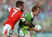 2 September 2000; Liam Hassett of Kerry is tackled by Andrew McCann of Armagh during the Bank of Ireland All-Ireland Senior Football Championship Semi-Final Replay match between Kerry and Armagh at Croke Park in Dublin. Photo by Brendan Moran/Sportsfile