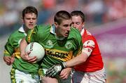 2 September 2000; Darragh O'Se of Kerry is tackled by Andrew McCann of Armagh during the Bank of Ireland All-Ireland Senior Football Championship Semi-Final Replay match between Kerry and Armagh at Croke Park in Dublin. Photo by Brendan Moran/Sportsfile