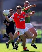 2 September 2000; John McEntee of Armagh in action against Mike Hassett of Kerry during the Bank of Ireland All-Ireland Senior Football Championship Semi-Final Replay match between Kerry and Armagh at Croke Park in Dublin. Photo by Brendan Moran/Sportsfile