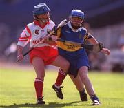 3 September 2000; Deirdre Hughes of Tipperary in action against Denise Cronin of Cork during the All-Ireland Senior Camogie Championship Final match between Tipperary and Cork at Croke Park in Dublin. Photo by Pat Murphy/Sportsfile