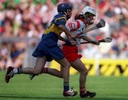 3 September 2000; Elaine Burke of Cork in action against Una O'Dwyer of Tipperary during the All-Ireland Senior Camogie Championship Final match between Tipperary and Cork at Croke Park in Dublin. Photo by Pat Murphy/Sportsfile