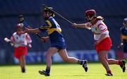3 September 2000;  Emer McDonnell of Tipperary in action against Mary O'Connor of Cork during the All-Ireland Senior Camogie Championship Final match between Tipperary and Cork at Croke Park in Dublin. Photo by Pat Murphy/Sportsfile