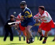3 September 2000; Emer McDonnell of Tipperary in action against Mags Finn of Cork during the All-Ireland Senior Camogie Championship Final match between Tipperary and Cork at Croke Park in Dublin. Photo by Pat Murphy/Sportsfile