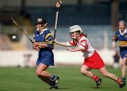 3 September 2000; Claire Madden of Tipperary in action against Elaine Burke of Cork during the All-Ireland Senior Camogie Championship Final match between Tipperary and Cork at Croke Park in Dublin. Photo by Pat Murphy/Sportsfile