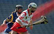 3 September 2000; Una O'Donoghue of Cork in action against Suzanne Kelly of Tipperary during the All-Ireland Senior Camogie Championship Final match between Tipperary and Cork at Croke Park in Dublin. Photo by Pat Murphy/Sportsfile