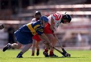 3 September 2000; Deirdre Hughes of Tipperary in action against Eithne Duggan of Cork during the All-Ireland Senior Camogie Championship Final match between Tipperary and Cork at Croke Park in Dublin. Photo by Pat Murphy/Sportsfile