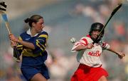 3 September 2000; Deirdre Hughes of Tipperary in action against Ursula Troy of Cork during the All-Ireland Senior Camogie Championship Final match between Tipperary and Cork at Croke Park in Dublin. Photo by Pat Murphy/Sportsfile