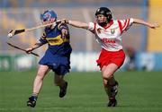 3 September 2000; Deirdre Hughes of Tipperary in action against Ursula Troy of Cork during the All-Ireland Senior Camogie Championship Final match between Tipperary and Cork at Croke Park in Dublin. Photo by Pat Murphy/Sportsfile