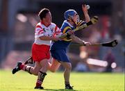 3 September 2000; Deirdre Hughes of Tipperary in action against Mags Finn of Cork during the All-Ireland Senior Camogie Championship Final match between Tipperary and Cork at Croke Park in Dublin. Photo by Pat Murphy/Sportsfile