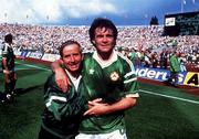 12 June 1988; Republic of Ireland's Charlie O'Leary, left and Ray Houghton celebrate after defeating England. European Championship Finals 1988, Group B, Republic of Ireland v England, Neckarstadion, Stuttgart, Germany. Picture credit: Ray McManus / SPORTSFILE