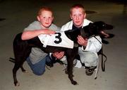 8 September 2000; Master Emmett Sweeney, and his brother, Gerard, left, with Tuesdays Holly, a heat winner in the DJ Reilly Millennium Puppy Derby, at Harolds Cross Greyhound racing Stadium in Dublin. Photo by Ray McManus/Sportsfile