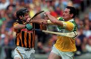 10 September 2000; Kevin Kinahan of Offaly is tackled by DJ Carey of Kilkenny during the All-Ireland Senior Hurling Championship Final match between Kilkenny and Offaly at Croke Park in Dublin. Photo by Aoife Rice/Sportsfile