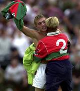 9 September 2000; Dermot Geraghty, Mayo celebrates with a  supporter after their teams victory over Westmeath during the All-Ireland Minor Football Final Semi-Final replay match between Mayo and Westmeath in Carrick on Shannon, Leitrim. Photo by Damien Eagers / Sportsfile