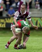 9 September 2000; Paul Carey of Mayo is tackled by Daniel McDermott of Westmeath during the All-Ireland Minor Football Final Semi-Final replay match between Mayo and Westmeath in Carrick on Shannon, Leitrim. Photo by Damien Eagers / Sportsfile