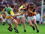 10 September 2000; John Hoyne of Kilkenny is tackled by Brian Whelahan of Offaly during the All-Ireland Senior Hurling Championship Final match between Kilkenny and Offaly at Croke Park in Dublin. Photo by Aoife Rice/Sportsfile