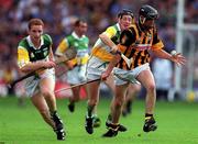 10 September 2000; John Hoyne of Kilkenny is tackled by Brian Whelahan of Offaly during the All-Ireland Senior Hurling Championship Final match between Kilkenny and Offaly at Croke Park in Dublin. Photo by Ray McManus/Sportsfile