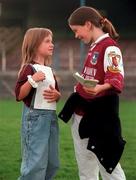 13 September 2000; Pictured are Galway fans Tara Treacy (right) and her sister Claudia, hoping to get autographs from Galway players during the Galway Senior Football Press Night at Tuam Stadium in Galway. Photo by Damien Eagers/Sportsfile