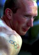 14 September 2000. Irish sprinter Paul Brizzel with the Olympic Rings tattooed onto his arms at a warm up meeting at the Sydney International Athletic centre. Sydney Olympic Park. Homebush Bay, Sydney in Australia. Photo by Brendan Moran/Sportsfile