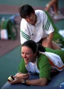 14 September 2000. Irish sprinter Ciara Sheehy is given a muscle rub by Irish athletics team physio Afric Morrissey during a warm up meeting at the Sydney International Athletic centre at Sydney Olympic Park, Homebush Bay, Sydney in Australia. Photo by Brendan Moran/Sportsfile