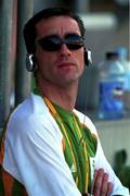 14 September 2000. Ireland's Mark Carroll relaxes before his 3000m race at a warm up meeting at the Sydney International Athletic centre. Sydney Olympic Park. Homebush Bay, Sydney, Australia. Photo by Brendan Moran/Sportsfile