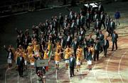 15 September 2000; The Irish team wave to the crowd on the parade lap during the Opening Ceremony of the XXVII Olympic Games. Stadium Australia, Sydney Olympic Park. Homebush Bay, Sydney, Australia. Photo by Brendan Moran/Sportsfile