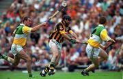 10 September 2000; DJ Carey of Kilkenny iin action against Kevin Martin, left, and Simon Whelahan of Offaly during the All-Ireland Senior Hurling Championship Final match between Kilkenny and Offaly at Croke Park in Dublin. Photo by Ray McManus/Sportsfile