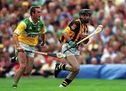 10 September 2000; DJ Carey of Kilkenny in action against Kevin Martin of Offaly during the All-Ireland Senior Hurling Championship Final match between Kilkenny and Offaly at Croke Park in Dublin. Photo by Ray McManus/Sportsfile