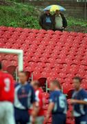 17 September 2000; Two spectators watch on during the Eircom League Premier Division match between Cork City and Derry City at Turners Cross in Cork. Photo by David Maher/Sportsfile